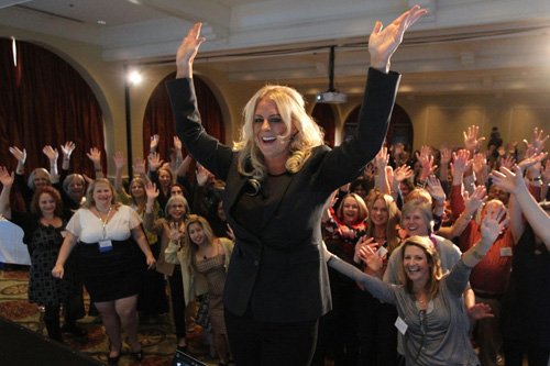 Christie Marie Sheldon on stage with fans and event attendies