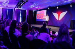 An author speaking on stage