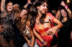 Crowd dancing to the rhythm of an A-Fest party