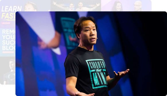 Screenshot of a video of Jim Kwik on stage
