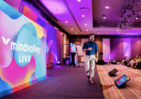 Vishen on stage at Mindvalley Live